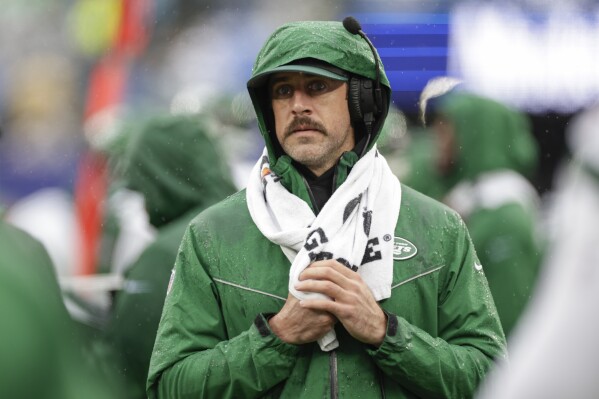 New York Jets quarterback Aaron Rodgers (8) works the sidelines during the first half of an NFL football game against the New York Giants, Sunday, Oct. 29, 2023, in East Rutherford, N.J. (AP Photo/Adam Hunger)