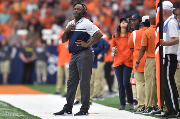 FILE - Syracuse head coach Dino Babers stands on the sideline during the first half of an NCAA college football game against Purdue in Syracuse, N.Y., Saturday, Sept. 17, 2022. Babers was selected top coach in the Associated Press ACC Midseason Awards, Wednesday, Oct. 12, 2022. (AP Photo/Adrian Kraus, File)