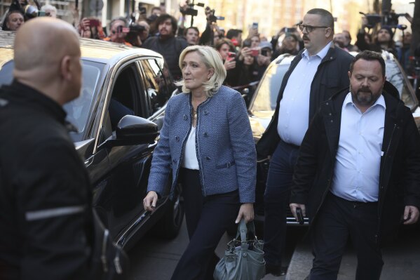 French far-right leader Marine Le Pen leaves the National Rally headquarters after a French court convicted Marine Le Pen of embezzlement and barred her from seeking public office for five years, Monday, March 31, 2025 in Paris. (AP Photo/Thomas Padilla)