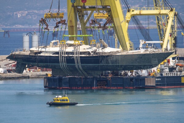 The hull of the superyacht Bayesian, which sank near Palermo, Sicily, on August 19, 2024, is taken to the shipyard in Termini Imerese, Italy, Sunday, June 22, 2025. (AP Photo/Salvatore Cavalli)