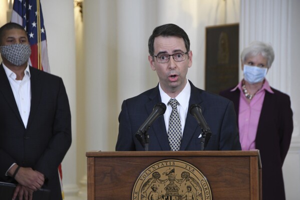 FILE - Roy McGrath, CEO of the Maryland Environmental Service, speaks at the State House in Annapolis, Md., April 15, 2020. McGrath, who failed to appear for his trial on federal corruption charges died after suffering two gunshot wounds — one of them self-inflicted — as FBI agents closed in on him in Tennessee. That's according to an autopsy report made public Friday, July 28, 2023. McGrath died on April 4 near Knoxvillle, Tennessee, after he failed to appear at Baltimore’s federal courthouse for his March 13 trial. (Pamela Wood/The Baltimore Sun via AP)