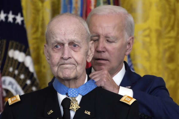 President Joe Biden awards the Medal of Honor to Capt. Larry Taylor, an Army pilot from the Vietnam War who risked his life to rescue a reconnaissance team that was about to be overrun by the enemy, during a ceremony Tuesday, Sept. 5, 2023, in the East Room of the White House in Washington. (AP Photo/Jacquelyn Martin)