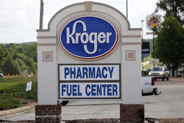 FILE - A Kroger grocery store sign promotes its pharmacy and fuel center at its Flowood, Miss., location, Thursday, June 15 2017. Kroger on Friday, Sept. 8, 2023, announced an agreement to pay up to $1.4 billion to settle lawsuits that claimed the company contributed to the U.S. opioid crisis.(AP Photo/Rogelio V. Solis, File)