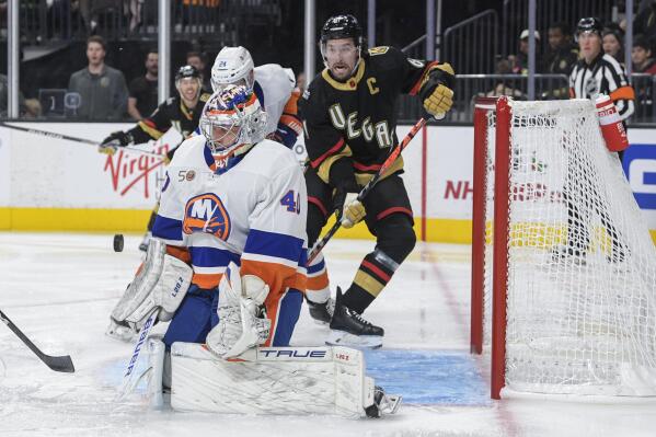 New York Islanders goaltender Semyon Varlamov (40) stops a shot by the Vegas Golden Knights during the second period of an NHL hockey game Saturday, Dec. 17, 2022, in Las Vegas. (AP Photo/Sam Morris)