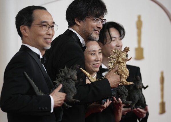 Masaki Takahashi, from left, Takashi Yamazaki, Kiyoko Shibuya and Tatsuji Nojima arrive at the Oscars on Sunday, March 10, 2024, at the Dolby Theatre in Los Angeles. (AP Photo/Ashley Landis)