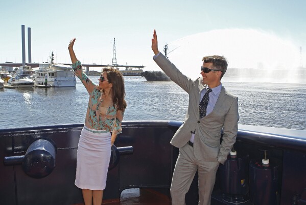 FILE - Denmark's Crown Prince Frederik and Crown Princess Mary wave from the tugboat "Svitzer Marysville" during its naming ceremony in Melbourne, Australia, Thursday, Nov 24, 2011. (Scott Barbour, Pool Photo via AP, File)