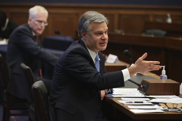 FBI Director Christopher Wray testifies before a House Committee on Homeland Security hearing Thursday, Sept. 17, 2020, on Capitol Hill Washington. National Counterterrorism Center Director Christopher Miller is left.  (Chip Somodevilla/Pool via AP)