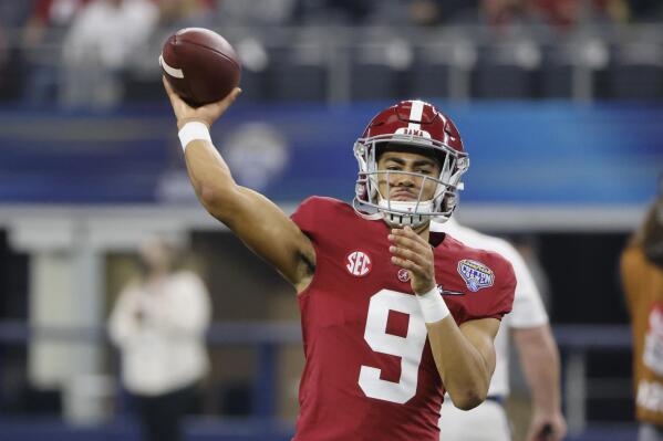 FILE - Alabama quarterback Bryce Young (9) throws a pass against Cincinnati during the first half of the Cotton Bowl NCAA College Football Playoff semifinal game, Friday, Dec. 31, 2021, in Arlington, Texas. Young was named to The Associated Press preseason All-America team, Monday, Aug. 22, 2022. (AP Photo/Michael Ainsworth, File)