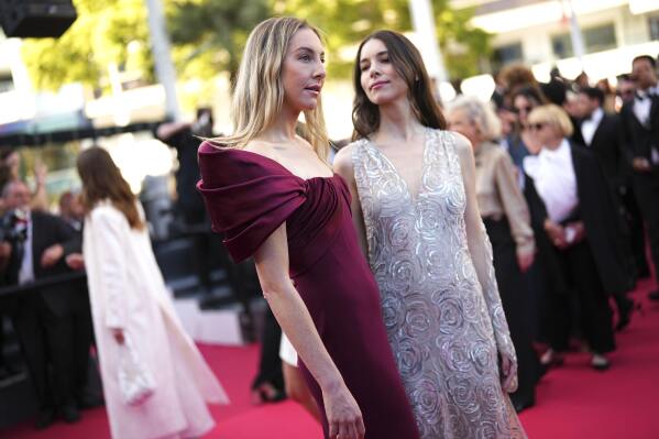 Este Haim, left, and Danielle Haim pose for photographers upon arrival at the premiere of the film 'The Mastermind' at the 78th international film festival, Cannes, southern France, Friday, May 23, 2025. (Photo by Scott A Garfitt/Invision/AP)