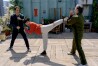 This image released by Sony Pictures shows, from left, Ralph Macchio, Ben Wang and Jackie Chan in a scene from "Karate Kid: Legends." (Jonathan Wenk/Sony Pictures via AP)