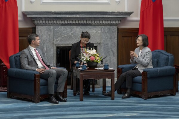 In this photo released by the Taiwan Presidential Office, Paraguay's president-elect Santiago Pena, left, and Taiwan's President Tsai Ing-wen speak during a meeting in Taipei, Taiwan, Wednesday, July 12, 2023. (Taiwan Presidential Office via AP)