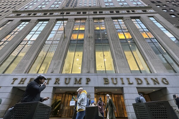 People walk by The Trump Building office building at 40 Wall Street in New York City, Friday, Nov. 3, 2023.  (AP Photo/Ted Shaffrey, File)
