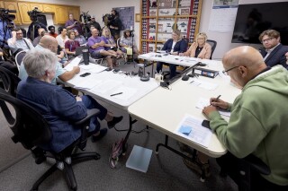 The Goodhue council convenes for a special meeting to address the police department in Goodhue, Minn. The small town will soon be without a police department, an exodus spurred by low pay for the chief and his officers. (Carlos Gonzalez/Star Tribune via AP)
