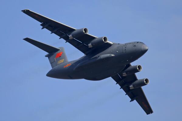 FILE - A Y-20 transport aircraft of the Chinese People's Liberation Army (PLA) Air Force performs during the 12th China International Aviation and Aerospace Exhibition, also known as Airshow China 2018, in Zhuhai city, southern China on Nov. 7, 2018. Media and military experts said Sunday, April 10, 2022, that six Chinese Air Force Y-20 transport planes landed at Belgrade's commercial airport early Saturday, reportedly carrying HQ-22 surface-to-air missile systems for the Serbian military.(AP Photo/Kin Cheung, File)