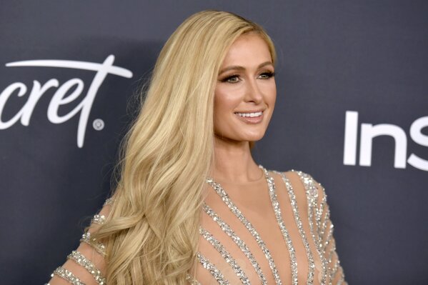 FILE - Paris Hilton arrives at the InStyle and Warner Bros. Golden Globes afterparty on Jan. 5, 2020, in Beverly Hills, Calif. Hilton announced her engagement to entrepreneur Carter Reum in her social media post on Wednesday, Feb. 17, 2021, the same day as her birthday. (Richard Shotwell/Invision/AP, File)