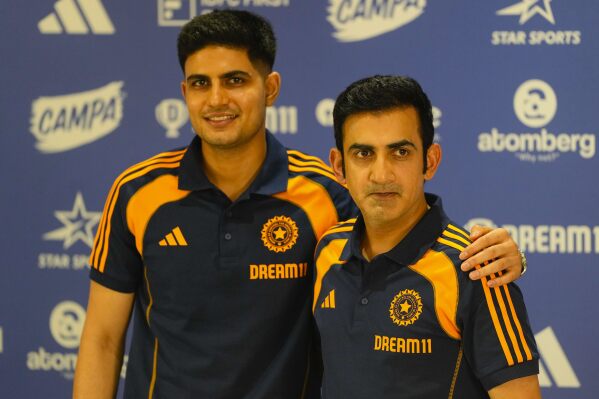Indian cricket test team captain Shubman Gill , left , and head coach Gautam Gambhir poses for picture after addressing a pre-departure press conference ahead of India tour to England at the Board of Control for Cricket headquarters in Mumbai, Thursday, June 5, 2025. (AP Photo/Rafiq Maqbool)