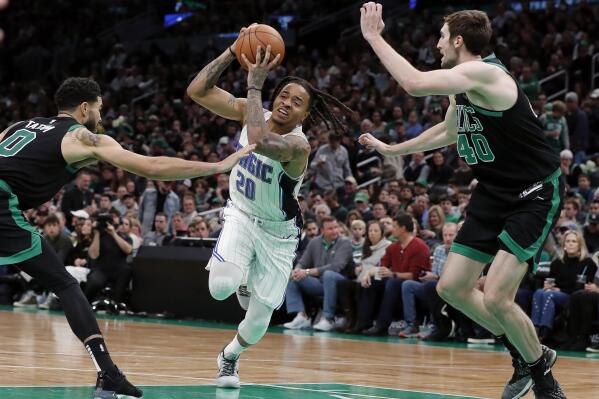 Luke Kornet of the Boston Celtics looks to pass against the New