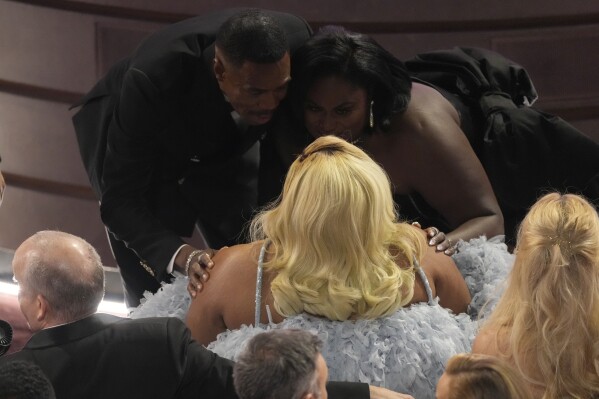 Colman Domingo, from left, Da'Vine Joy Randolph, and Danielle Brooks speak during the Oscars on Sunday, March 10, 2024, at the Dolby Theatre in Los Angeles. (AP Photo/Chris Pizzello)