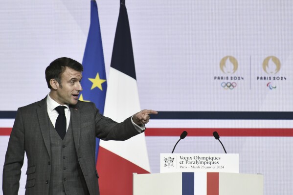 French President Emmanuel Macron delivers a speech to present his New Year's wishes to elite athletes ahead of the Paris 2024 Olympic and Paralympic Games, at France's National Institute of Sport, Expertise, and Performance (INSEP) in Paris, Tuesday, Jan. 23, 2024. (Stephane De Sakutin/Pool Photo via AP)