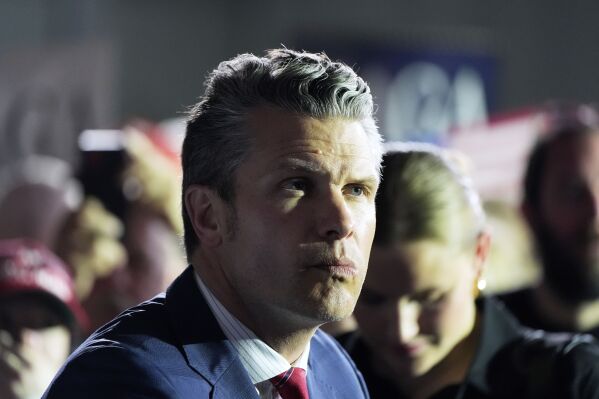 Defense Secretary Pete Hegseth arrives before President Donald Trump speaks on his first 100 days at Macomb County Community College Sports Expo Center, Tuesday, April 29, 2025, in Warren, Mich. (AP Photo/Alex Brandon)