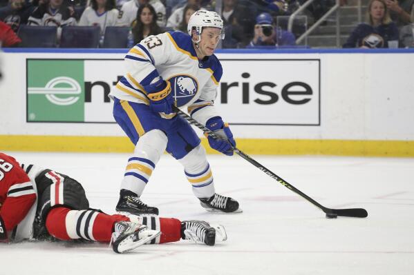 Buffalo Sabres left wing Jeff Skinner (53) skates around Chicago Blackhawks defenseman Erik Gustafson (56) as he approaches the net during the second period of an NHL hockey game Friday, April 29, 2022, in Buffalo, N.Y. (AP Photo/Joshua Bessex)