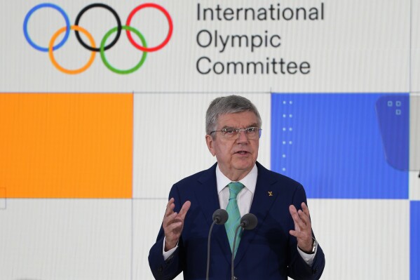 Thomas Bach, IOC President speaks at the International Olympic Committee launch of the Olympic AI Agenda at Lee Valley VeloPark, in London, Friday, April 19, 2024. They will be presenting the envisioned impact that artificial intelligence can deliver for sport, and how the IOC intends to lead on the global implementation of AI within sport. (AP Photo/Kirsty Wigglesworth)