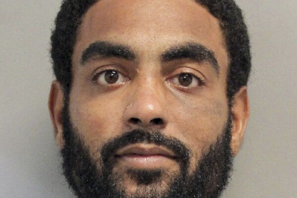 This undated photo provided by the Harris County Sheriff’s Office shows Michael Devon Combs. The search continued Wednesday, Oct. 18, 2023 for Combs, an inmate who managed to walk out of a Houston courthouse after being left unattended by deputies who were responding to a brawl in a nearby courtroom. (Harris County Sheriff’s Office via AP)
