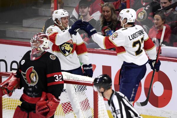 Florida Panthers centre Carter Verhaeghe (23) celebrates his goal against the Ottawa Senators with Eetu Luostarinen (27) during the third period of an NHL hockey game Thursday, April 28, 2022, in Ottawa, Ontario. (Justin Tang/The Canadian Press via AP)