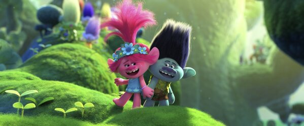 This image released by DreamWorks Animation shows characters Branch, voiced by Justin Timberlake, right, and Poppy, voiced by Anna Kendrick in a scene from "Trolls World Tour." Universal Pictures is calling the “Trolls World Tour” digital release a success and suggests it may be the beginning of a sea change in how movies are released. Theater owners strenuously disagree. AMC Theaters, the largest chain in the United States, is signaling an all-out war, saying it will refuse to play Universal movies. (DreamWorks Animation via AP)