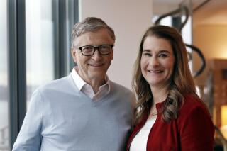 FILE - In this Feb. 1, 2019, file photo, Bill Gates and Melinda French Gates pose together in Kirkland, Wash.  The Bill and Melinda Gates Foundation announced Wednesday, Jan. 26, 2022, its adding four new members to its board of trustees. It's a first for the Seattle-based philanthropic giant, whose decision making has been guided by very few hands since its incorporation in 2000. (AP Photo/Elaine Thompson, File)