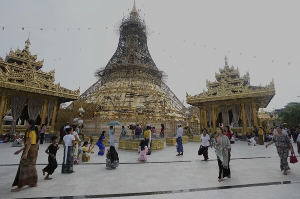 Buddhist devotees visit Botataung pagoda during a religious ceremony to mark the Full Moon day of "Kasone," known as Buddha's Birthday, Sunday, May 11, 2025, in Yangon, Myanmar. (AP Photo/Thein Zaw)