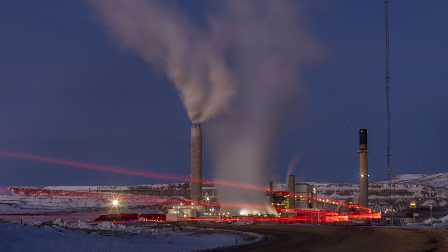 FILE - Taillights trace the path of a motor vehicle at the Naughton Power Plant, Jan. 13, 2022, in Kemmerer, Wyo. Bill Gates and his energy company ar