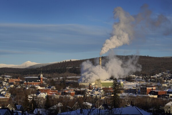 Steam billows from the Burgess Biopower mill in Berlin, N.H., Sunday, Jan. 21, 2024. (AP Photo/Robert F. Bukaty)