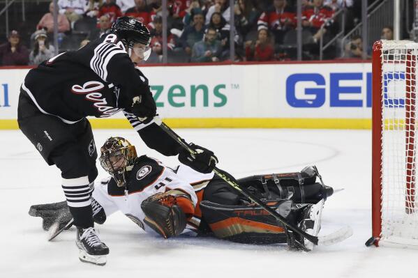 Anaheim Ducks goaltender Anthony Stolarz (41) makes a pad save against New Jersey Devils center Jack Hughes (86) during the second period of an NHL hockey game Tuesday, Oct. 18, 2022, in Newark, N.J. (AP Photo/Noah K. Murray)