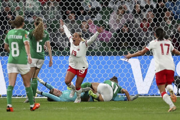 Canada's Adriana Leon, center, celebrates after scoring her side's second goal during the Women's World Cup Group B soccer match between Canada and Ireland in Perth, Australia, Wednesday, July 26, 2023. (AP Photo/Gary Day)