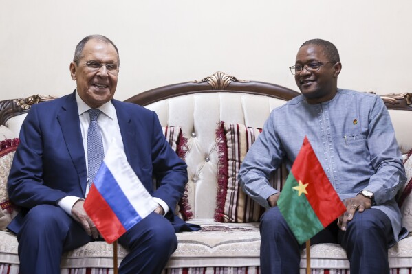 In this photo released by Russian Foreign Ministry Press Service, Russian Foreign Minister Sergey Lavrov, left, and Minister of Foreign Affairs of the Republic of Burkina Faso Karamoko Jean-Marie Traoré smile posing for a photo during their meeting in Ouagadougou, Burkina Faso, Tuesday, June 4, 2024. Moscow pledged more support to Burkina Faso in fighting extremist military groups, as the Russian foreign minister continues his whirlwind tour of West Africa in an attempt to fill in the vacuum left by the region's traditional Western partners. (Russian Foreign Ministry Press Service via AP)