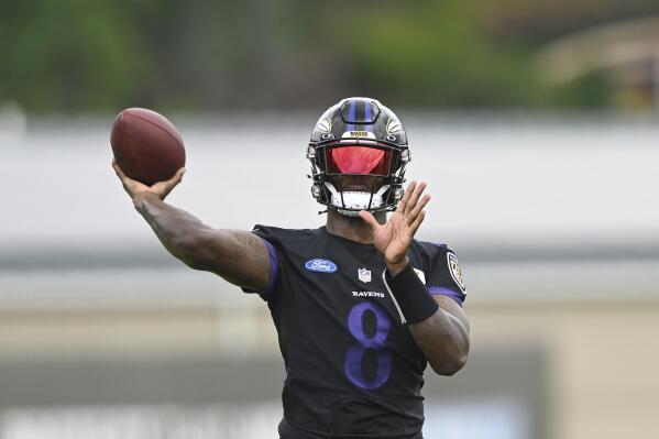 Baltimore Ravens quarterback Lamar Jackson takes part in drills at the NFL football team's training camp in Owings Mills, Md., Wednesday, July 27, 2022. (AP Photo/Gail Burton)