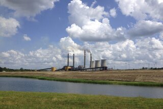 
              FILE - This June 3, 2014, file photo shows a panoramic view of the Paradise Fossil Plant in Drakesboro Ky. President Donald Trump's vow to save the coal industry will be tested this week when a utility board he appoints weighs whether to close a coal-fired power plant in Kentucky whose suppliers include a mine owned by one of his campaign donors. An environmental assessment by the Tennessee Valley Authority recommends shuttering the remaining coal-fired unit at the Paradise Fossil Plant in Muhlenberg County. The board could vote on Thursday, Feb. 14, 2019. (AP Photo/Dylan Lovan, File)
            