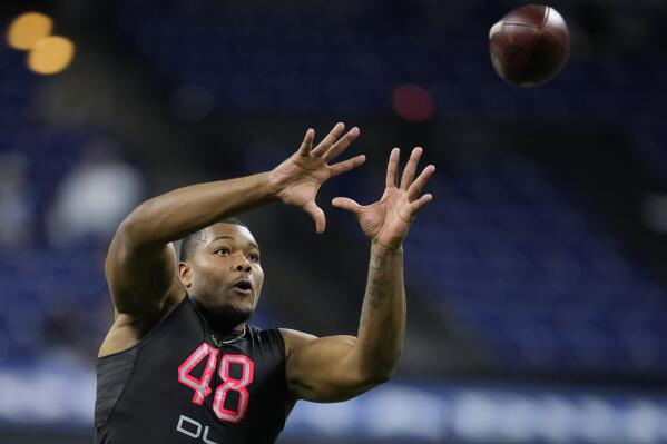 Jags take 'athletic freak' Walker with top pick in NFL draft