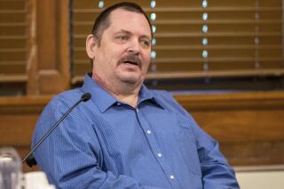 FILE - In this July 9, 2019, file photo, Aubrey Trail testifies during his murder trial at the Saline County Courthouse in Wilber, Neb. Trail was sentenced to death Wednesday, June 9, 2021, for killing and dismembering a Nebraska hardware store clerk who refused to commit to his lifestyle of group sex and fraud. (Chris Machian/Omaha World-Herald via AP, File)