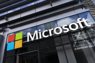This May 6, 2021 photo shows a sign for Microsoft offices in New York.  Federal law enforcement agencies secretly seek the data of Microsoft customers thousands of times a year. That's according to congressional testimony being given Wednesday, June 30,  by a senior executive at the technology company. (AP Photo/Mark Lennihan)