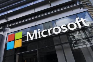This May 6, 2021 photo shows a sign for Microsoft offices in New York. Federal law enforcement agencies secretly seek the data of Microsoft customers thousands of times a year. That's according to congressional testimony being given Wednesday, June 30, by a senior executive at the technology company. (AP Photo/Mark Lennihan)