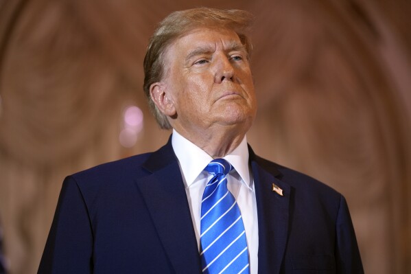 FILE - Republican presidential candidate former President Donald Trump speaks at a Super Tuesday election night party Tuesday, March 5, 2024, at Mar-a-Lago in Palm Beach, Fla. Fake images of Trump surrounded by smiling Black voters are circulating online, highlighting the potential dangers posed by artificial intelligence ahead of the 2024 election. (AP Photo/Evan Vucci, File)