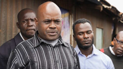 David Wangila, center, who believes his nephew Douglas Kalasinga was killed during one of the protests in July over new taxes and the rising cost of living, speaks to The Associated Press outside the city mortuary in Nairobi, Kenya, Friday, July 21, 2023. Data shared with the AP by a police watchdog, the Independent Medico-Legal Unit, showed 35 people killed by police across the country in such demonstrations this month. (AP Photo/ Khalil Senosi)