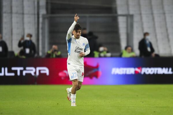 Marseille's Cengiz Under celebrates after scoring his side's first goal during a French League One soccer match between Marseille and Lille at the Velodrome stadium in Marseille, France, Sunday, Jan. 16, 2022. (AP Photo/Daniel Cole)