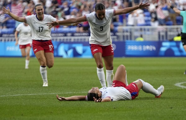 United States' Sophia Smith celebrates with team mates the opening goal during a women's semifinal soccer match between the United States and Germany at the 2024 Summer Olympics, Tuesday, Aug. 6, 2024, at Lyon Stadium in Decines, France. (AP Photo/Silvia Izquierdo)