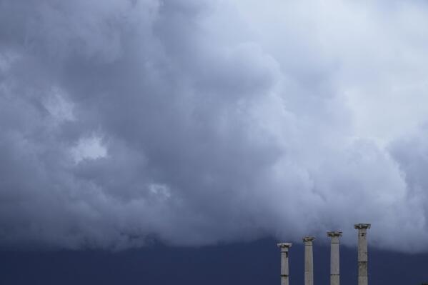 Clouds gather over the Pompeii archaeological site in southern Italy, Tuesday, Feb. 15, 2022. In a few horrible hours, Pompeii went from being a vibrant city to a dead one, smothered by a furious volcanic eruption in 79 AD. Then in this century, Pompeii appeared alarmingly on the precipice of a second death, assailed by decades of neglect, mismanagement and scanty systematic maintenance of heavily visited ruins. (AP Photo/Gregorio Borgia)