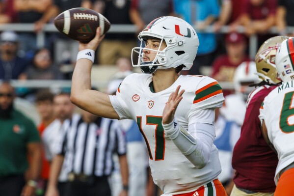 Miami quarterback Emory Williams looks to pass during the first half of an NCAA college football game against Florida State, Saturday, Nov. 11, 2023, in Tallahassee, Fla. (AP Photo/Colin Hackley)