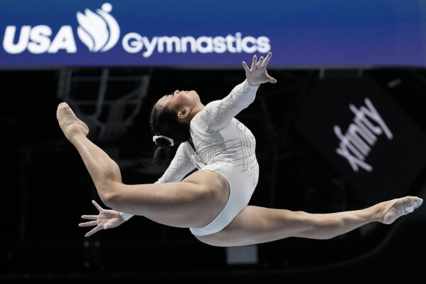 FILE - Sunisa Lee competes on the balance beam during the U.S. Gymnastics Championships Sunday, Aug. 27, 2023, in San Jose, Calif. Reigning Olympic all-around gymnastics champion Sunisa Lee headlines the initial draw for the U.S. Classic in Hartford, Connecticut next month. (AP Photo/Godofredo A. Vásquez, File)
