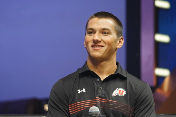 FILE - Utah safety Cole Bishop smiles during the NCAA college football Pac-12 media day Friday, July 21, 2023, in Las Vegas. Utah opens their season at home against Florida on Aug. 31. (AP Photo/Lucas Peltier, File)